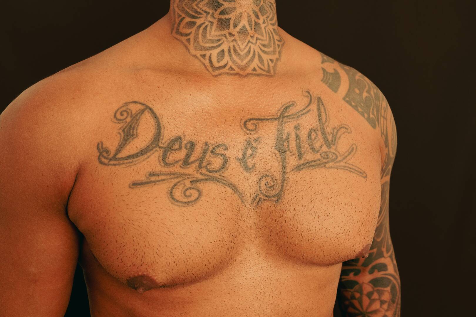 Chest tattoos.